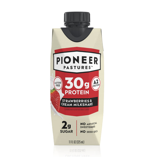 Pioneer Pastures milkshake container with strawberries and cream flavor on a white background
